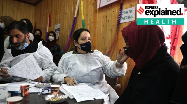 Doctors and medical workers collect personal details during a vaccination drive in Srinagar.