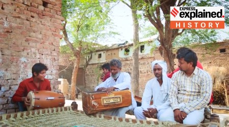 Members of the Meo Muslim community in Mewat playing a dholki and harmonium.