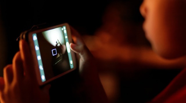 child on phone featured