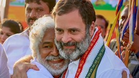 Congress leader Rahul Gandhi with Telangana folk singer Gummadi Vittal Rao. Rao who was popularly known as 'Gaddar' died at the age of 77. (Source: PTI Photo)