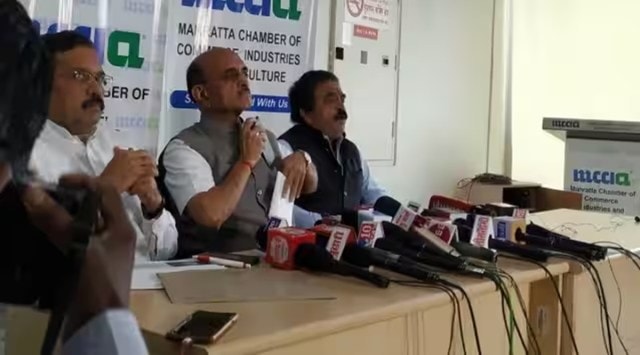 Loan disbursals to street vendors, Bhagwat Karad Gujarat visit, PM SVANidhi, implementation of PM SVANidhi, PM Street Vendor’s Atmanirbhar Nidhi scheme, free loan disbursals to street vendors, indian express news