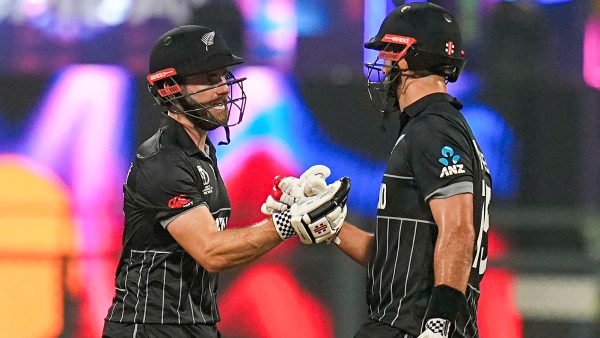 Mumbai: New Zealand's Daryl Mitchell celebrates his half century with captain Kane Williamson during the ICC Men's Cricket World Cup 2023 first semi-final match between India and New Zealand, at the Wankhede Stadium, in Mumbai, Wednesday, Nov. 15, 2023. (PTI Photo/Manvender Vashist Lav) (PTI11_15_2023_000579B)