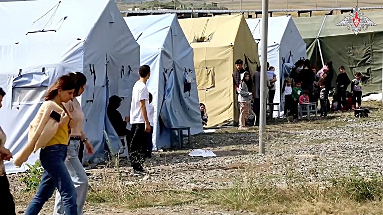 A view shows civilians evacuated by Russian peacekeepers following Azerbaijani armed forces' offensive operation in Nagorno-Karabakh, a region inhabited by ethnic Armenians, in an unknown location in Nagorno-Karabakh, in this still image from video published September 21, 2023. (Russian Defence Ministry/Handout via REUTERS)