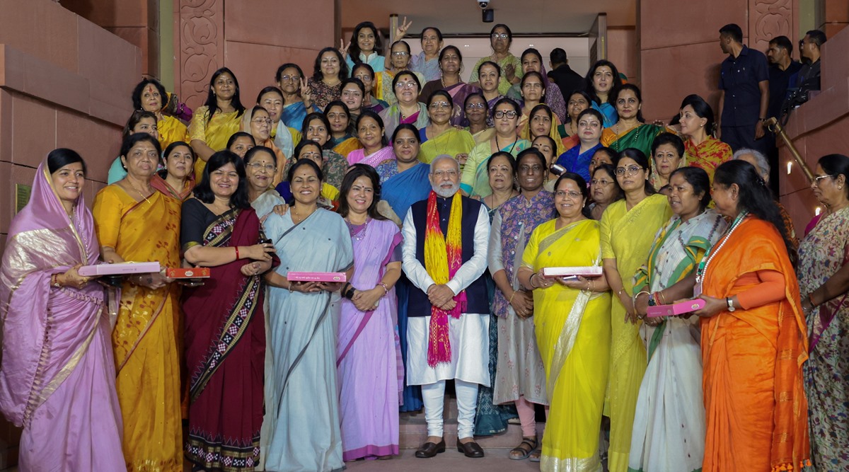PM Narendra Modi and women MPs celebrate the passing of the Women's Reservation Bill