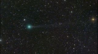 Comet Nishimura sporting a green coma and a thin tail.