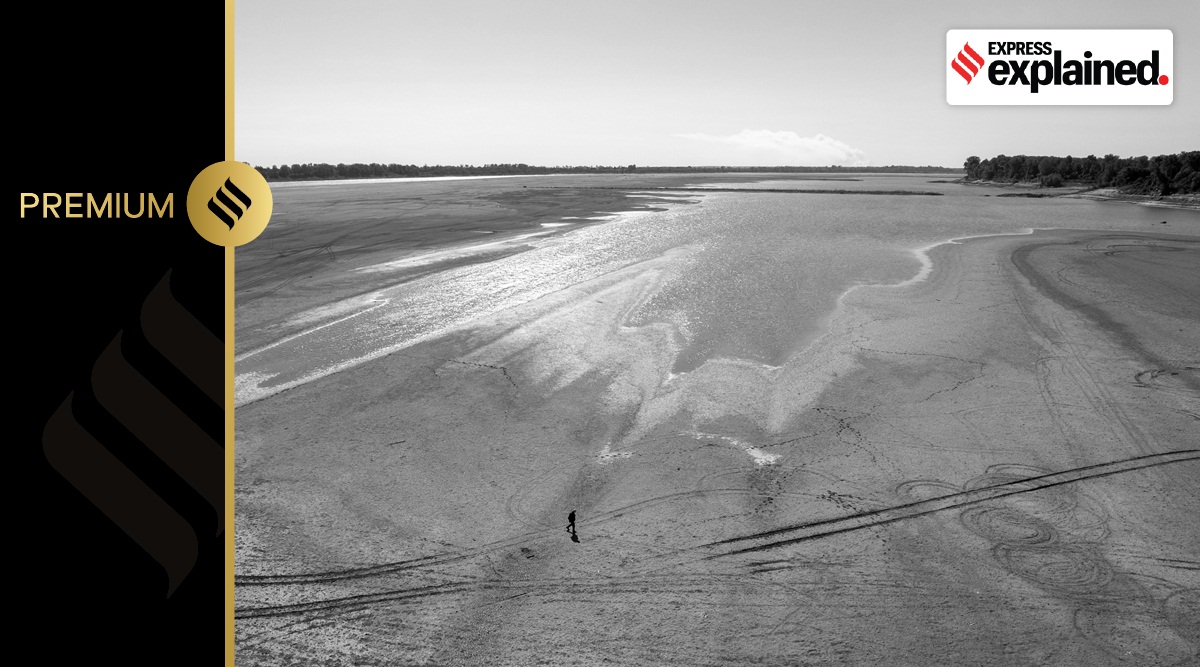 A man walks where the normally wide Mississippi River would flow, Oct. 20, 2022, near Portageville, Mo., USA.