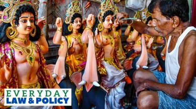 An artisan gives finishing touches to an idol of Lord Vishwakarma on the eve of Vishwakarma Puja, in Guwahati, Saturday, Sept. 16, 2023.