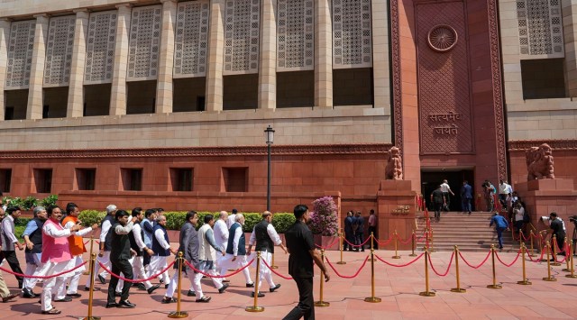 Prime Minister Narendra Modi with Union Ministers Amit Shah and Rajnath Singh and other parliamentarians enters the new Parliament building, in New Delhi. (PTI Photo)