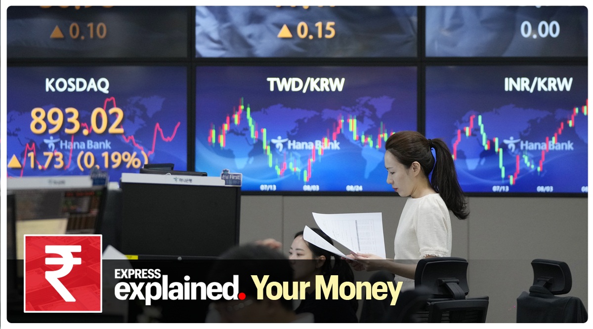 A currency trader reads documents at the foreign exchange dealing room of the KEB Hana Bank headquarters in Seoul, South Korea, Tuesday, Sept. 19, 2023. Asian shares mostly declined in cautious trading Tuesday ahead of the Federal Reserve’s looming decision on interest rates.