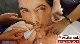 a poster of bollywood actor john abraham smoking.