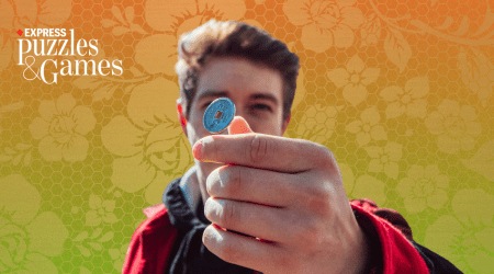 indian tricolour flag background with a man tossing a coin in front of it. this banner depicts the topics in indian express' sunday mini crossword for september 10, 2023
