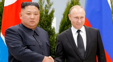 Russian President Vladimir Putin, right, and North Korea's leader Kim Jong Un shake hands during their meeting in Vladivostok, Russia,