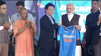 Prime Minister Narendra Modi with cricketer Sachin Tendulkar and UP CM Yogi Adityanath at the inauguration of the Varanasi cricket stadium.