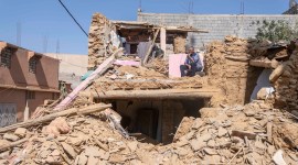 A man who lost his wife and daughter in the earthquake sits in what used to be his home, in the town of Amizmiz, outside Marrakech, Morocco, Sept. 14, 2023