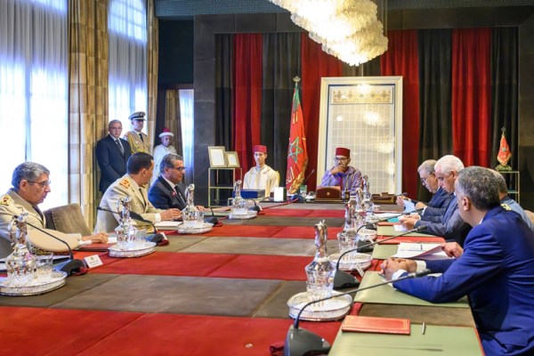 In this photo released by the Royal Palace, Morocco's King Mohammed VI, center, accompanied by Crown Prince Moulay El Hassan, center left, chairs a working session at the Royal Palace in Rabat in the early hours of Saturday Sept. 9, 2023. The session devoted to examining the situation following the earthquake that occurred on Friday, September 8. (Moroccan Royal Palace via AP)