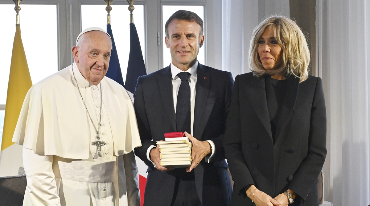 Pope Francis meets French President Emmanuel Macron, center, and his wife Brigitte at the Palais du Pharo, in Marseille, Franc
