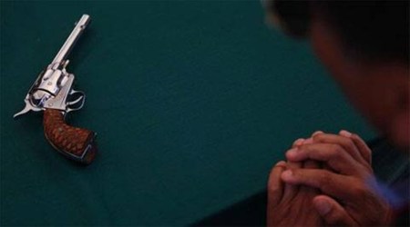 Revolver found in bale of garments accidentally goes off, man injured