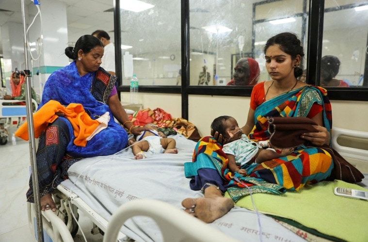 Laxmi Ujvalharangwari holds her one month old child Rudra, after he was diagnosed with pneumonia inside the pediatric ward of the Shankarrao Chavan Government Medical College and Hospital in Nanded