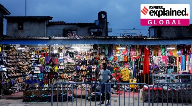 A vendor waits for customers at a shoe shop in a market in Colombo, Sri Lanka, November 14, 2022.