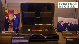 Photographs showing officials, including Russia's incumbent president Vladimir Putin, are on display next to the so-called Russia's nuclear briefcase also known as the "Cheget", at the exposition of the Boris Yeltsin Presidential Centre in Yekaterinburg, Russia, October 18, 2022.