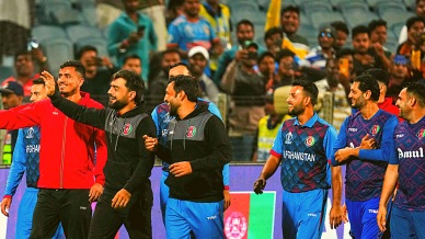 Afghanistan's players celebrate after winning their ICC Men's Cricket World Cup 2023 match against Sri Lanka, at Maharashtra Cricket Association Stadium in Pune, Monday, Oct. 30, 2023. (PTI Photo)