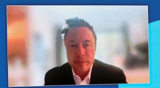 SpaceX Chief Executive Officer Elon Musk is seen on a screen as he addresses participants of the 74th International Astronautical Congress via a video link in Baku, Azerbaijan.