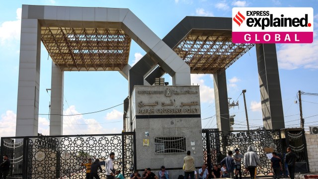 People gather on the Gaza side of the closed Rafah border crossing with Egypt on Monday, Oct. 16, 2023.