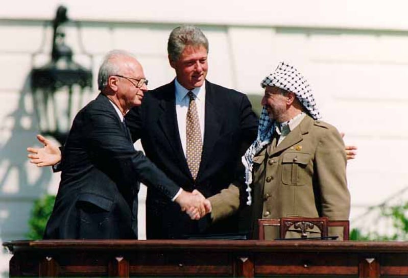 Israeli Prime Minister Yitzhak Rabin, U.S. president Bill Clinton, and PLO chairman Yasser Arafat at the Oslo Accords (Wikimedia Commons)
