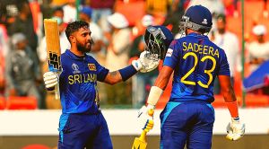 Sri Lanka's Kusal Mendis celebrates his century with Sadeera Samarawickrama during the ICC Men's Cricket World Cup match against Pakistan, at Rajiv Gandhi International Cricket Stadium, in Hyderabad, Tuesday, Oct. 10, 2023. (PTI Photo)