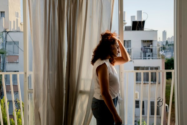 Rula Daoud, a director of Standing Together, at home in Jaffa, Israel, on Oct. 20, 2023. Long derided as naïve, even traitors, the bridge builders between Israelis and Palestinians sense opportunity in the aftermath of the Hamas attack. (Amit Elkayam/The New York Times)