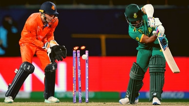 South Africa's captain Temba Bavuma is bowled by Netherlands' Roelof Van Der Merwe during the Cricket World Cup in Dharamsala. (AP Photo)