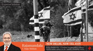 An Israeli soldier stands in position at the entrance to Kibbutz Kfar Aza