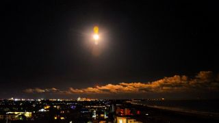 A SpaceX Falcon 9 rocket illuminates the sky as it is launched from Complex 40 at Cape Canaveral Space Force in Fla., Tuesday, Oct. 17, 2023. The rocket is carrying a batch of Starlink satellites.