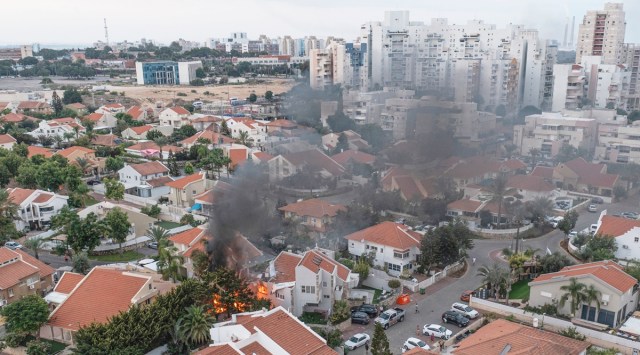 Smoke rises after a rocket fired from the Gaza Strip hit a house in Ashkelon, southern Israel, Saturday, Oct. 7, 2023. (AP)