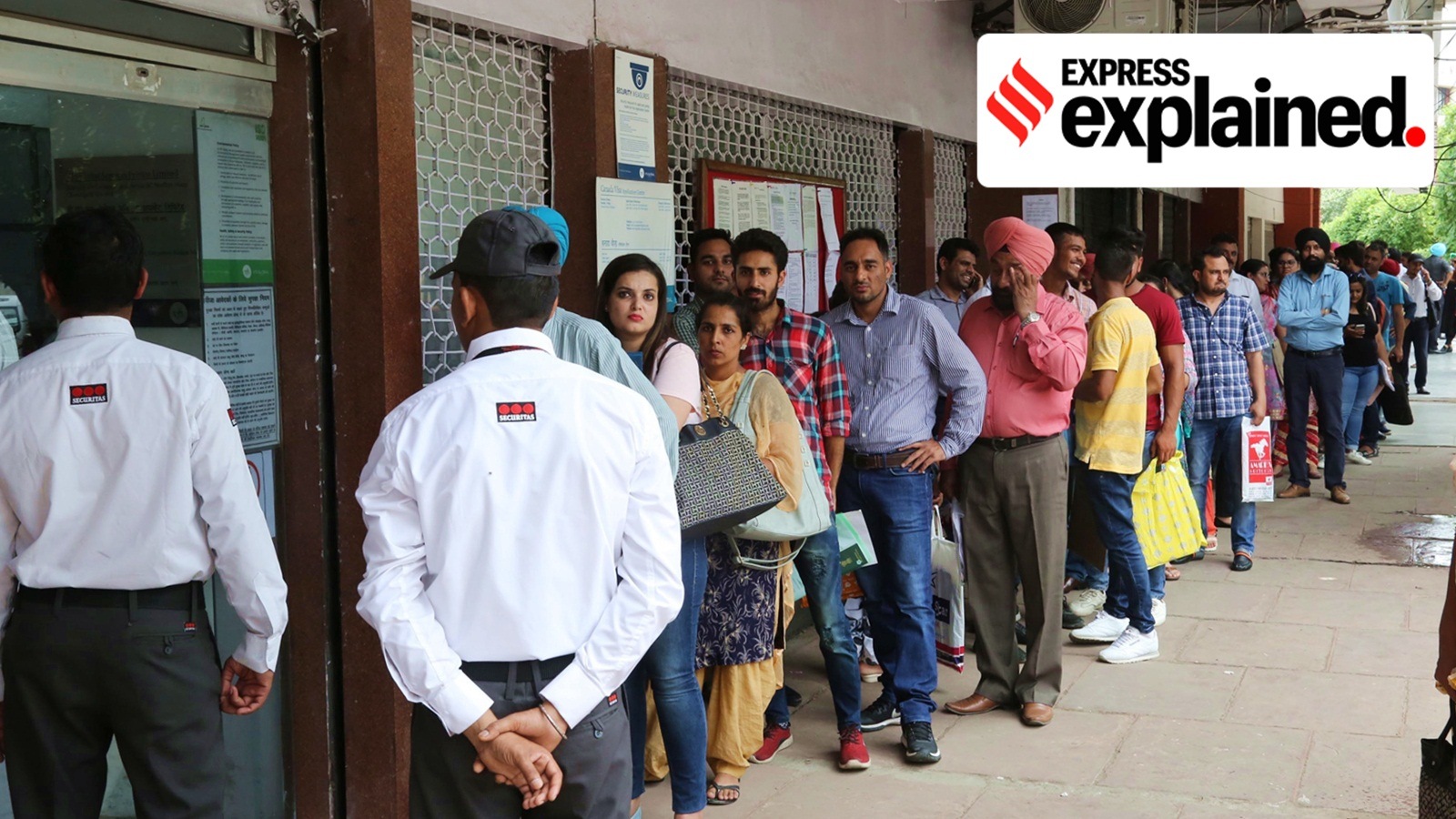 The issuance of student visas by Canada to Indians has been rising steadily since 2015. In this photo, people wait for their visas outside an office in Chandigarh.