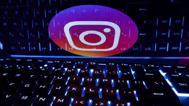 A keyboard is placed in front of a displayed Instagram logo in this illustration taken February 21, 2023. REUTERS/Dado Ruvic/Illustration