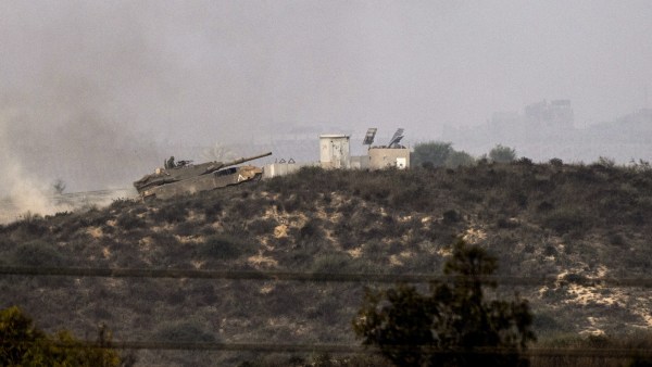 An Israeli tank ascending a hill near the border with Gaza, seen from Sderot, Israel, on the morning of Saturday, Oct. 28, 2023. On Friday evening, Israel made incursions into the Gaza Strip after intense artillery bombardment and airstrikes. The widespread blackout in Gaza made it difficult to discern the extent of continuing military actions there, but Israeli military officials declined to describe it as a full-scale invasion. (Tamir Kalifa/The New York Times).....