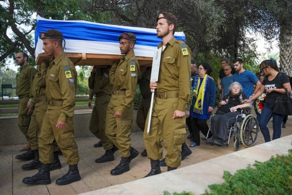 Israeli soldiers carry the flag-covered coffin of Ilai Bar Sade during his funeral at the military cemetery in Tel Aviv, Israel, Monday, Oct. 9, 2023. Bar Sade was killed after Hamas militants stormed from the blockaded Gaza Strip into nearby Israeli towns. Israel's vaunted military and intelligence apparatus was caught completely off guard, bringing heavy battles to its streets for the first time in decades. (AP Photo/Erik Marmor)