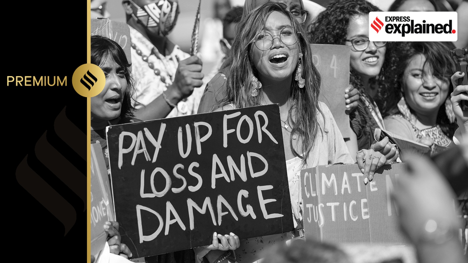Mitzi Jonelle Tan, of the Philippines, center, participates in a Fridays for Future protest calling for money for climate action at the COP27 U.N. Climate Summit, Nov. 11, 2022, in Sharm el-Sheikh, Egypt.