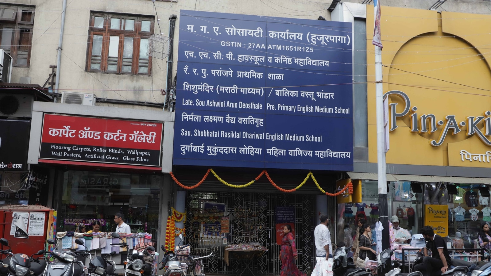 Campus main gate on Laxmi Road (Express Photo by Pavan Khengre)