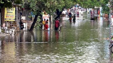 Chennai Rains News Live Updates: : People walk through waterlogged streets