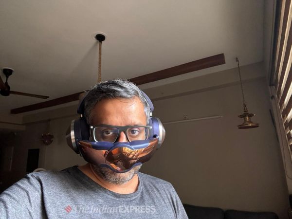 Man wearing Dyson Zone headphones and purifier