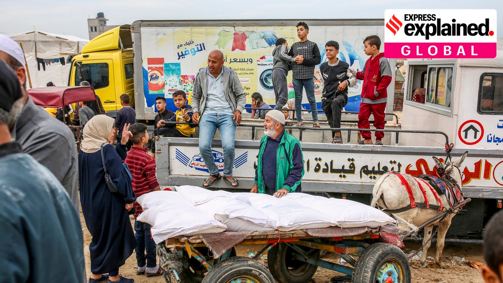 Flour is distributed to displaced people by the UNRWA, the United Nations agency that aids Palestinians, at the group's headquarters in Khan Younis, in the southern Gaza Strip, Nov. 22, 2023.