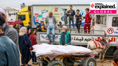 Flour is distributed to displaced people by the UNRWA, the United Nations agency that aids Palestinians, at the group's headquarters in Khan Younis, in the southern Gaza Strip, Nov. 22, 2023.