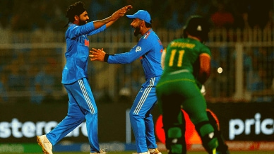 Ravindra Jadeja celebrates with Virat Kohli after taking the wicket of South Africa's Temba Bavuma REUTERS