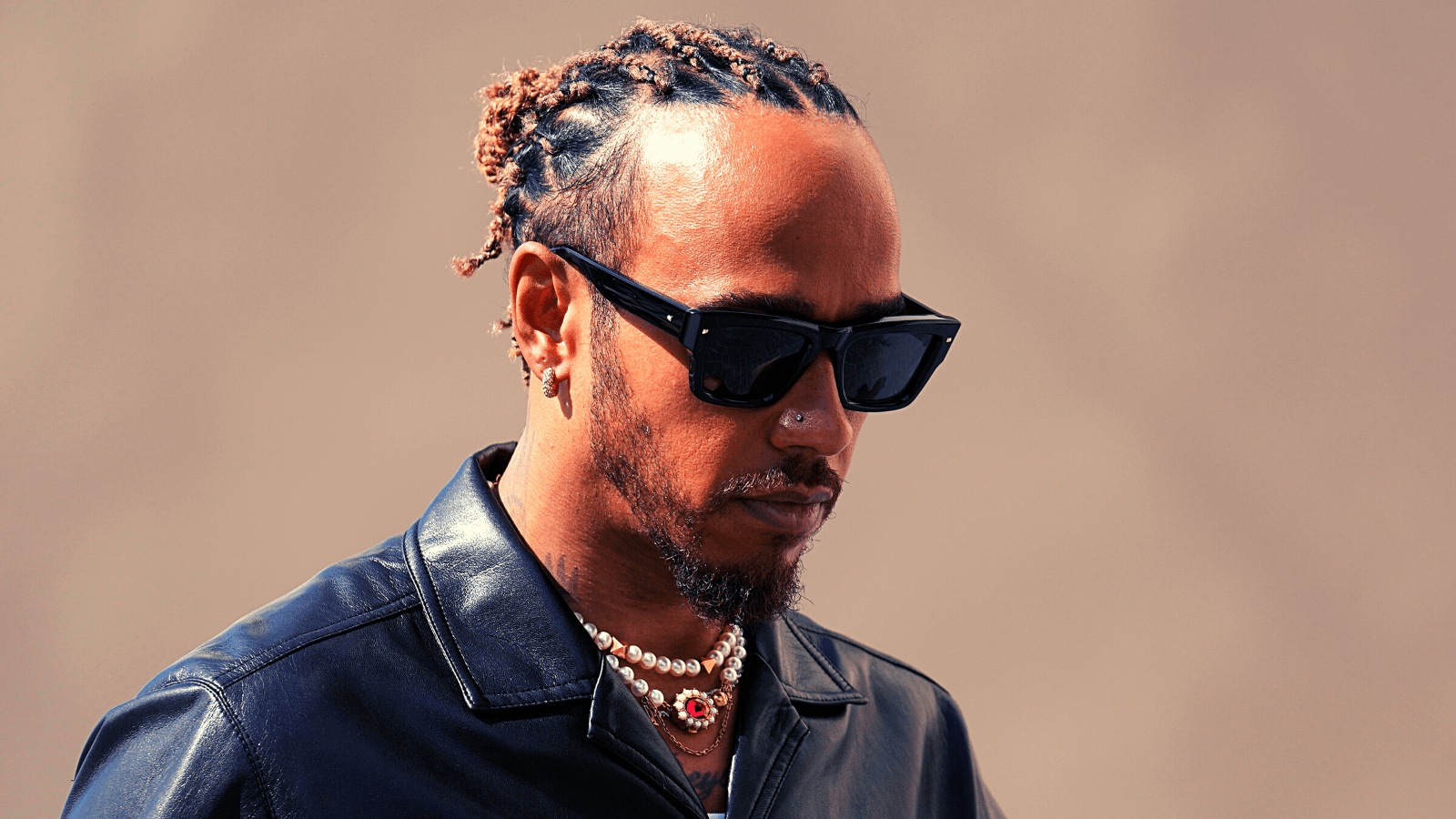 Mercedes driver Lewis Hamilton, of Britain arrives at the Yas Marina racetrack in Abu Dhabi, United Arab Emirates, Thursday, Nov. 23, 2023. (AP Photo