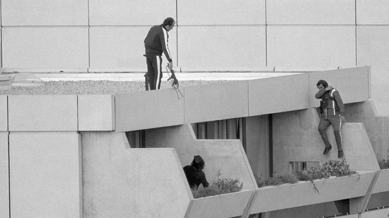 Members of the Black September Group storm the Olympic Village in Munich