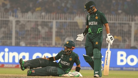 Mohammad Rizwan collapses with a cramp on the pitch after being bowled in the Pakistan versus England game on Saturday at the Eden Gardens in Kolkata. Express photo by Partha Paul