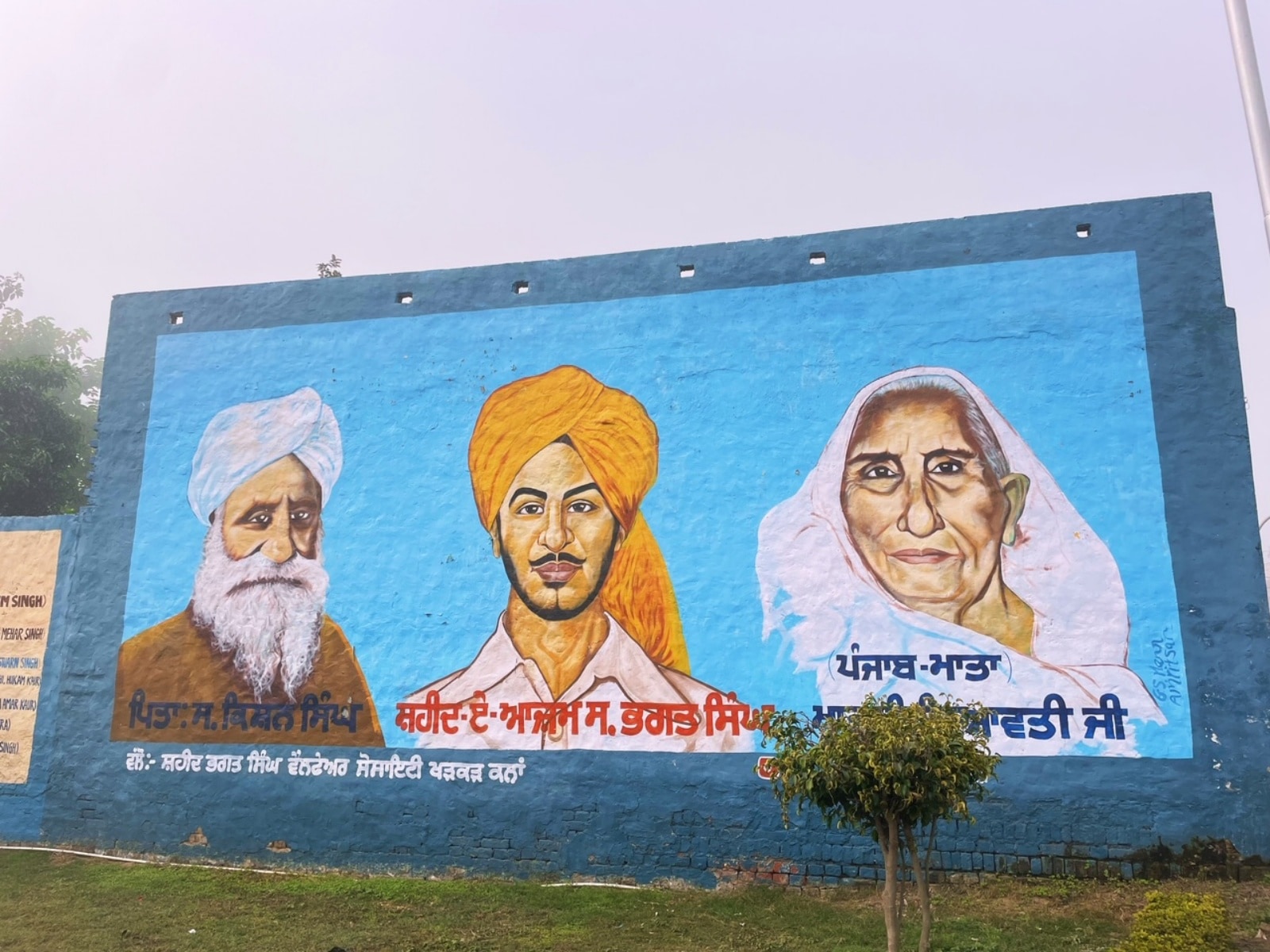 A mural of Bhagat Singh and his parents at Khatkar Kalan. 