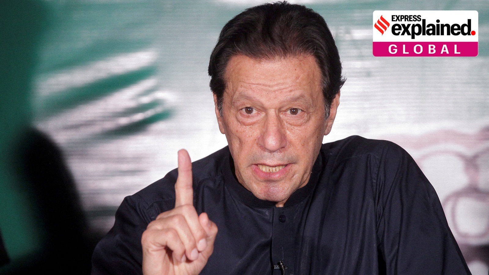 Pakistan's former Prime Minister Imran Khan gestures as he speaks to the members of the media at his residence in Lahore, Pakistan May 18, 202